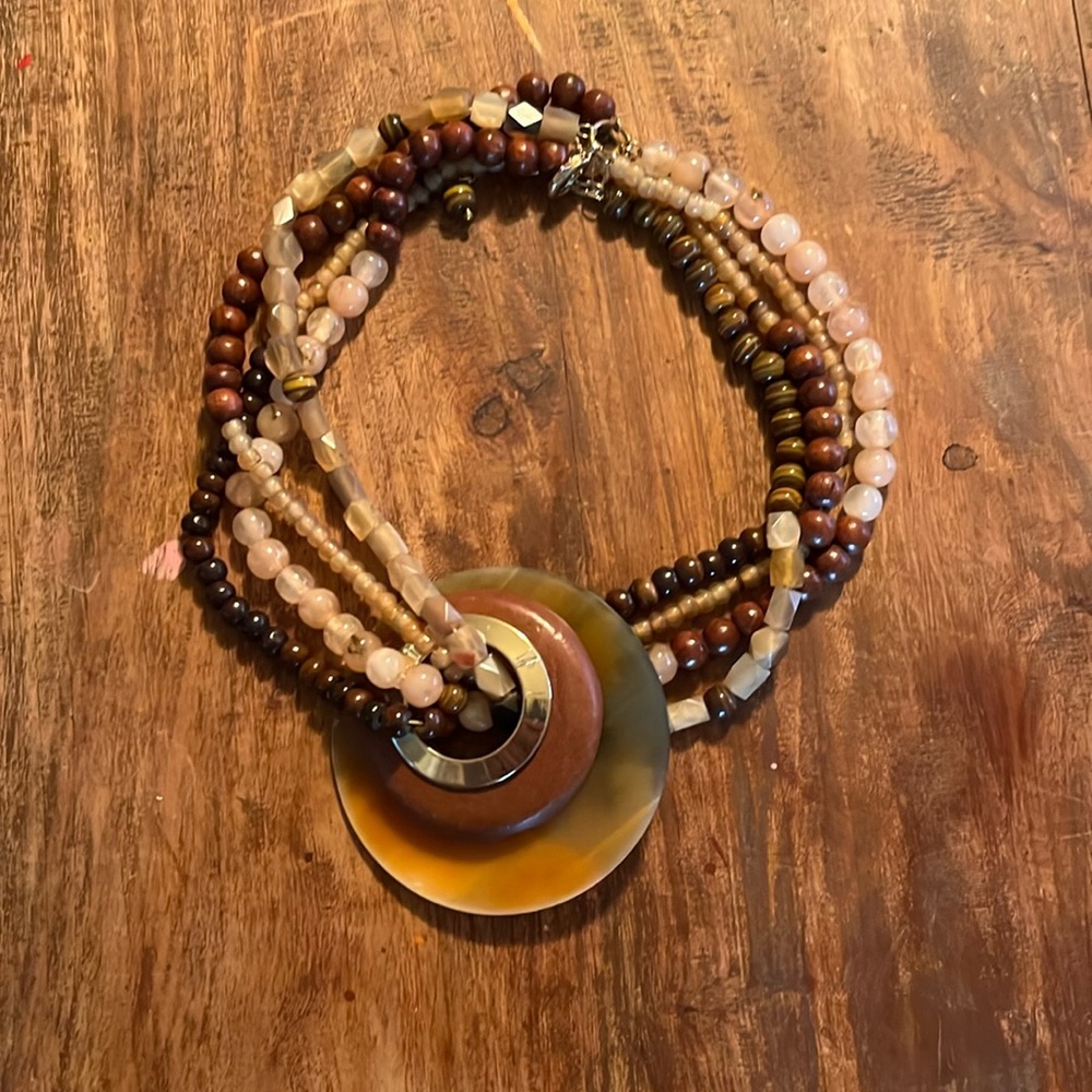 Interesting beaded necklace with large mother of pearl circle